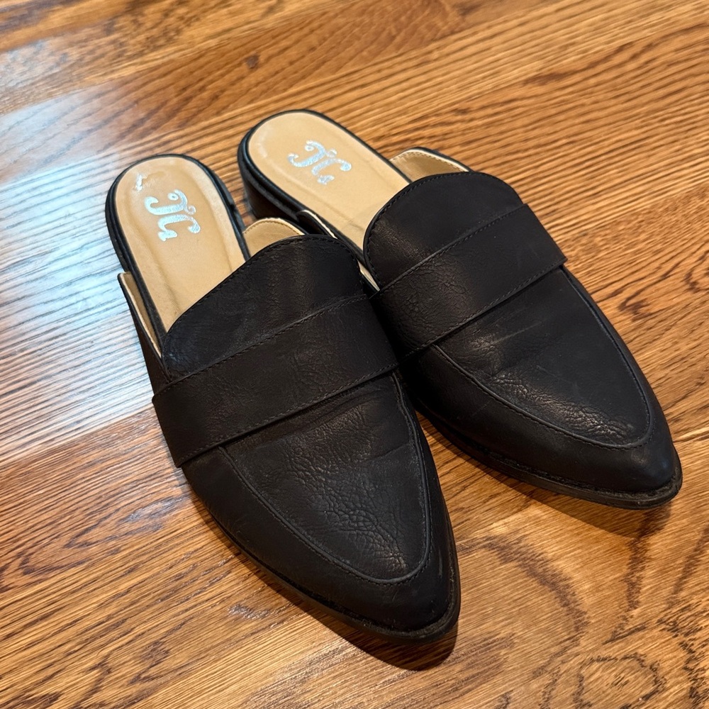 JG black leather mules flats